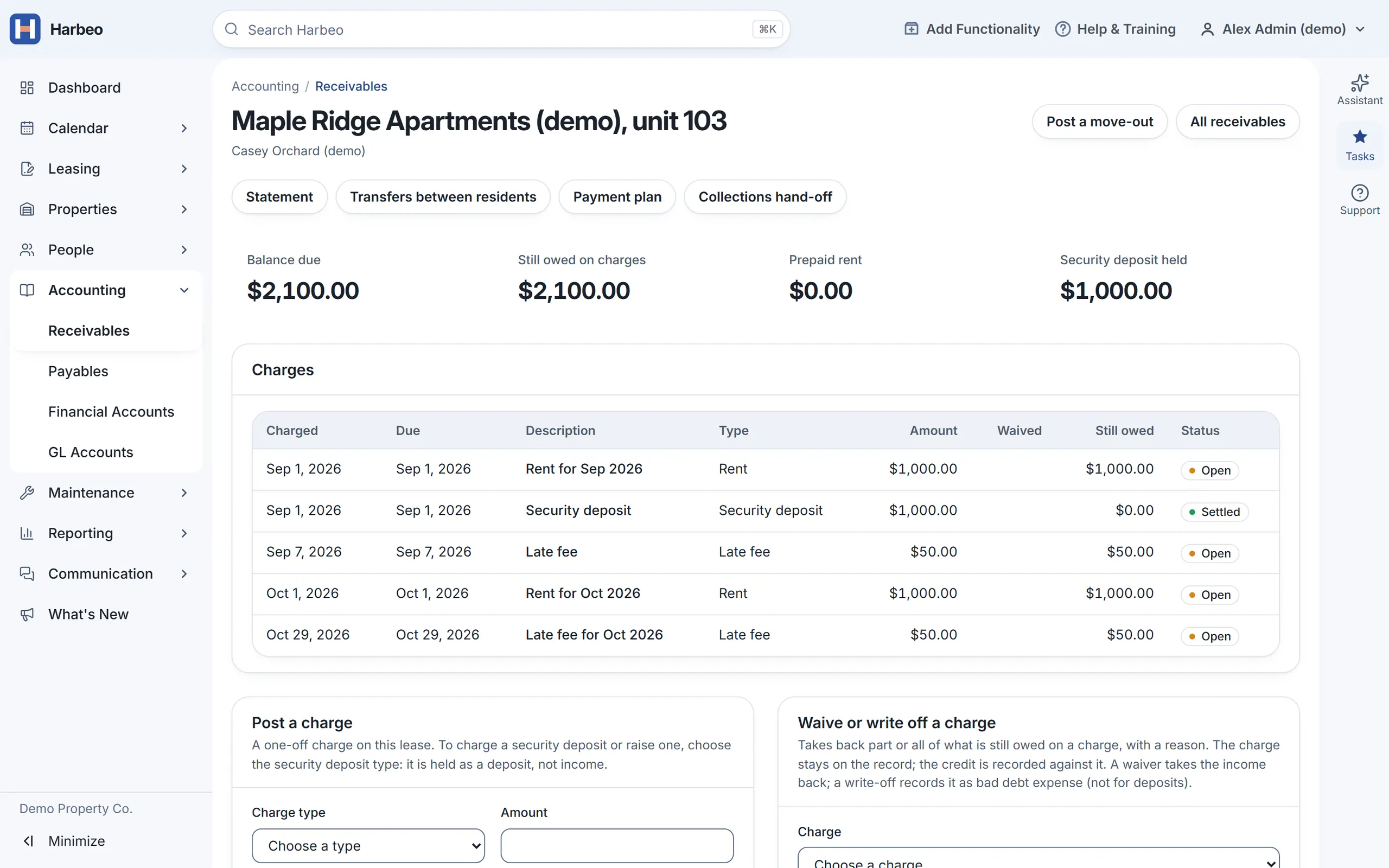 A tenant ledger with sample data: balance due $2,100, a $1,000 security deposit held, and rent and late fee charges with their status.